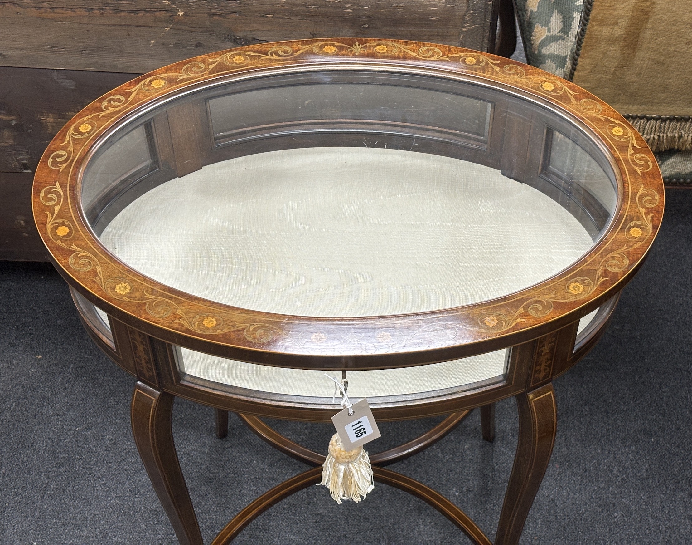 An Edwardian marquetry inlaid oval mahogany bijouterie table, width 61cm, depth 41cm, height 77cm